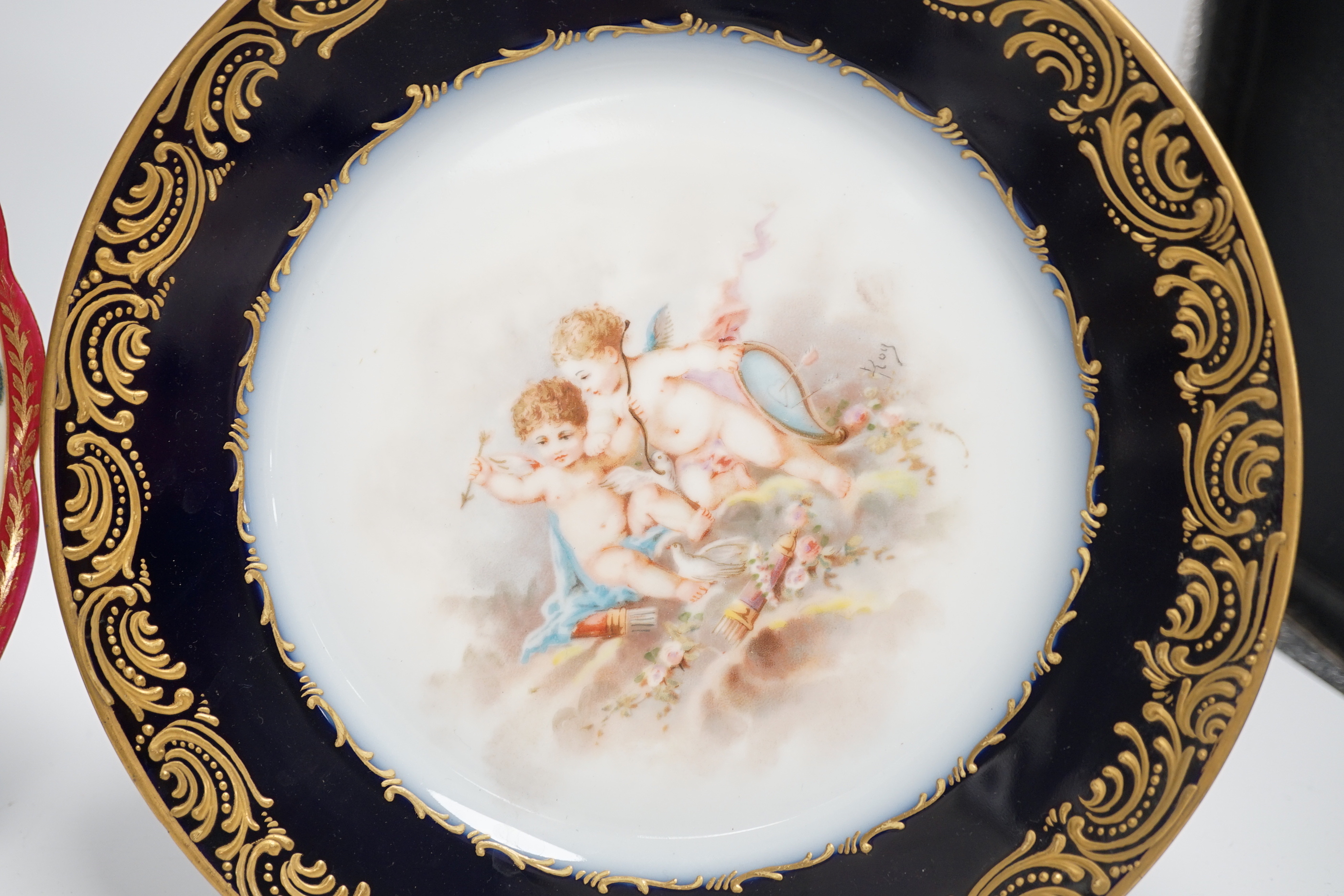 Two early 20th century Vienna style cabinet plates painted and enamelled with portraits and a Sevres style cabinet plate, 24cm (3)